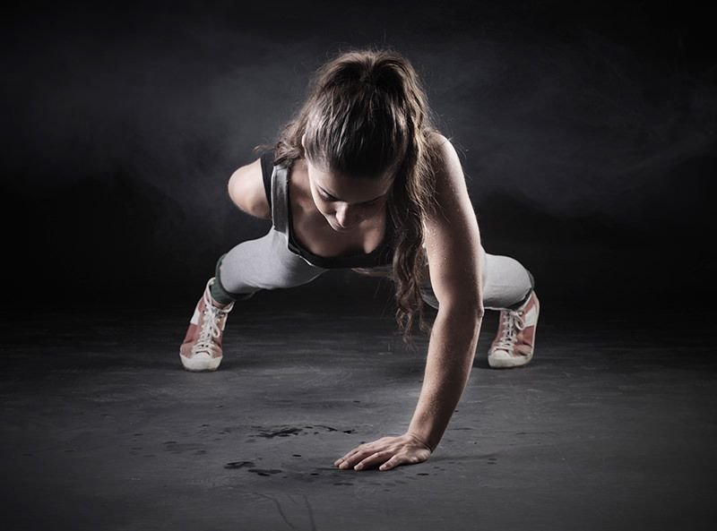Woman doing One-hand Pushup 1